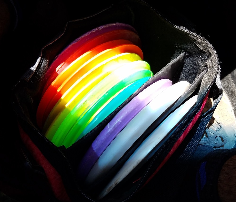 Colorful disc golf discs in bag