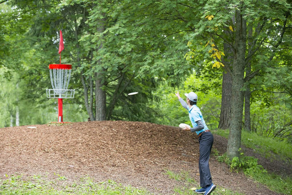 Disc golfer practice putting uphill to increase his putting distance