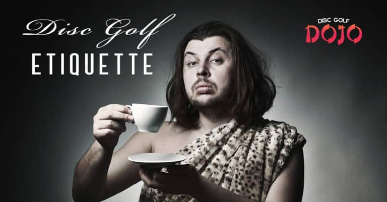 caveman drinking from a tea cup looking very dignified with good manners
